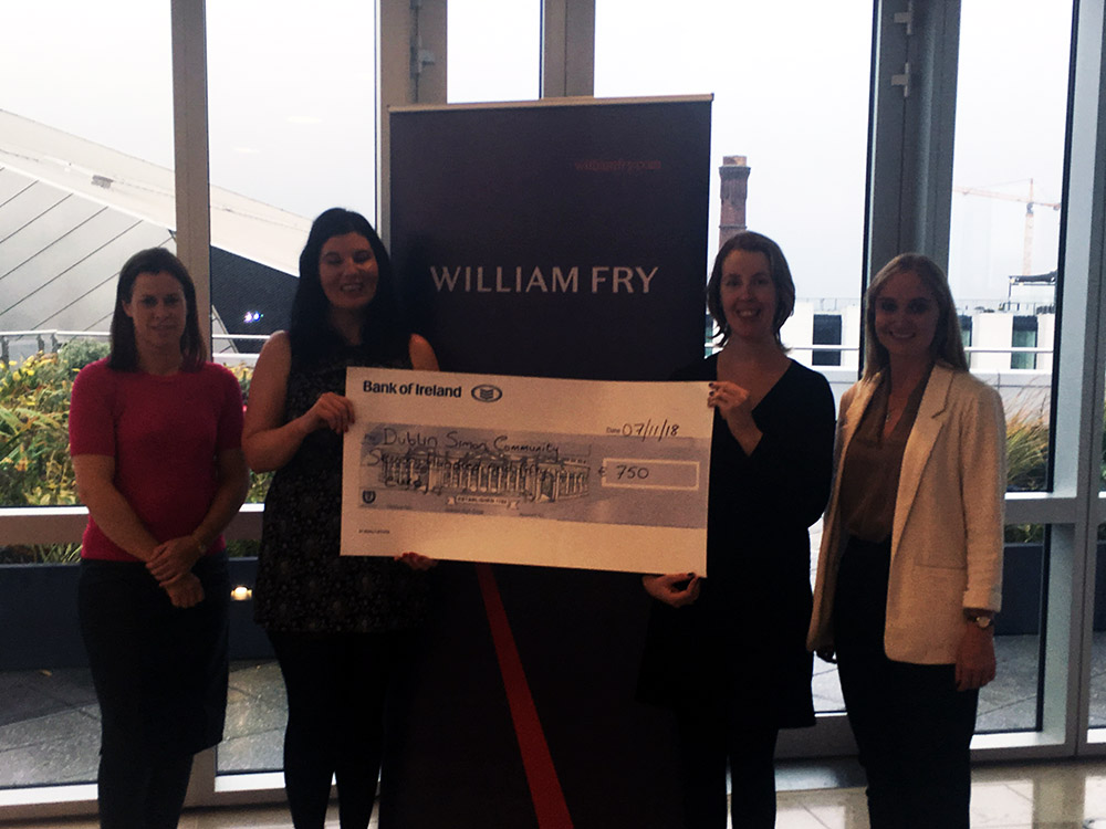 William Fry funds team presents €750 cheque to homelessness charity